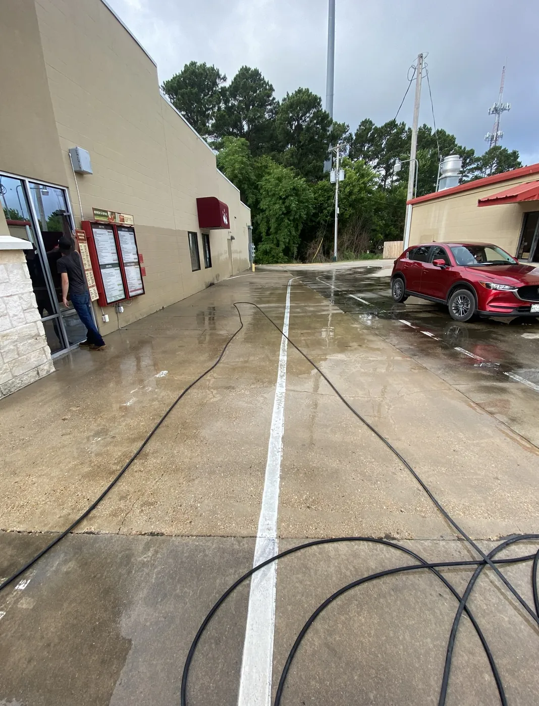After: restaurant drive lane and parking concrete cleaned by B&H