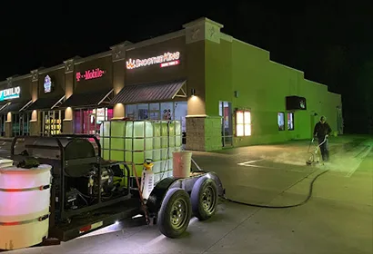 B&H wash rig cleaning a storefront after hours