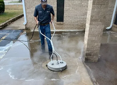 B&H technician running a surface cleaner on a patio